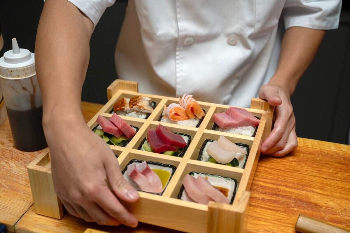 Owner and Chef Frank Zhu prepares a Mystery Box - $60 at Chef Frank sushi restaurant in North Natomas last month.
