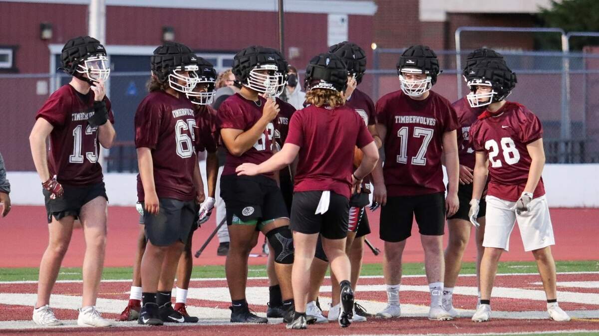 Woodcreek quarterback Garrett Krupp talks to his team during practice. The Timberwolves open up the season at home against Roseville on March 19.