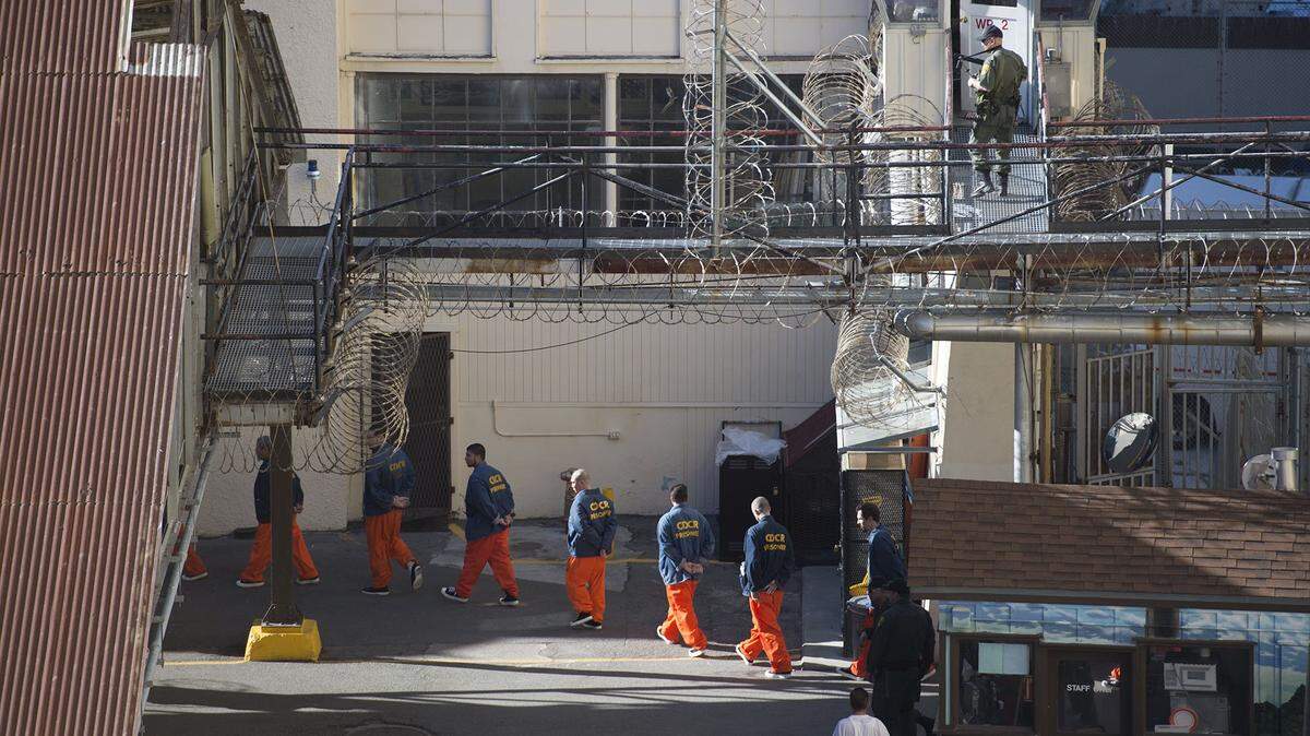 Inmates are moved through the prison at San Quentin State Prison on Tuesday, December. 29, 2015, in San Quentin, Calif.  