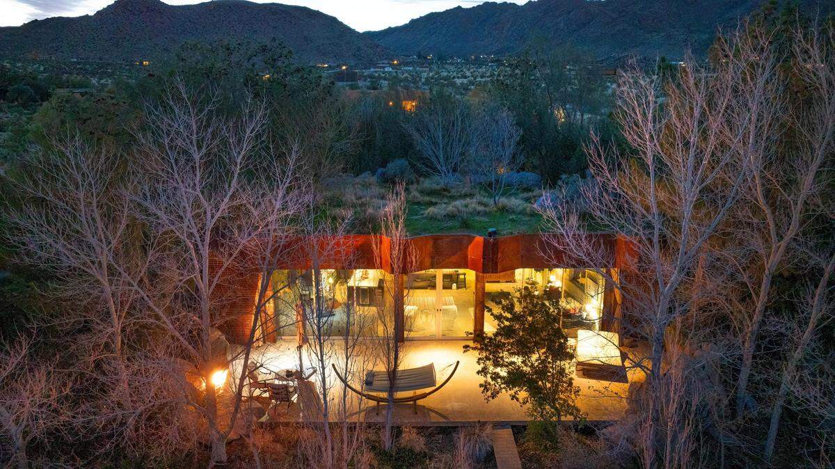 The roof is designed to look like a lush meadow and blend into the landscape.