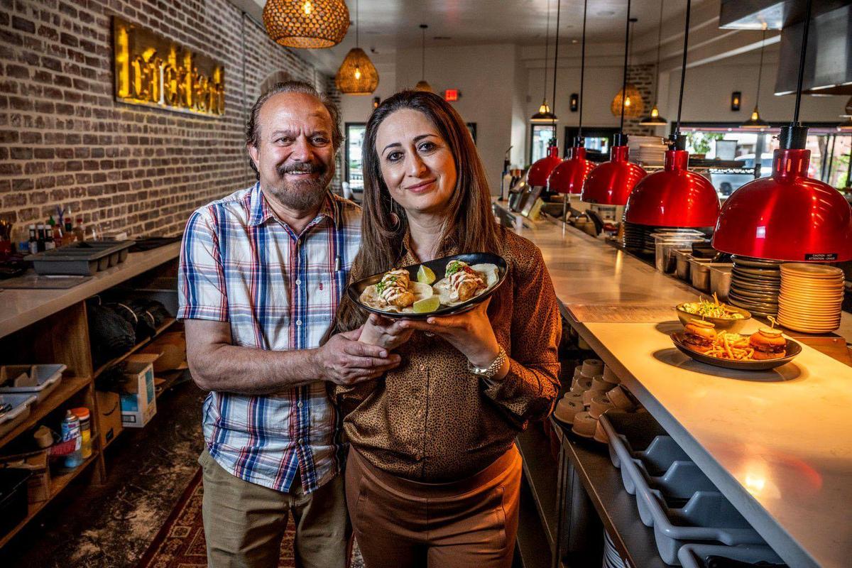 Rahim and Sheila Amiri, owners of Brickland Bistro in East Sacramento,  hold some of the food available at their restaurant Wednesday, June 14, 2023. The Amiris opened a cafe, called Brick Cafe, in the restaurant in August 2025.