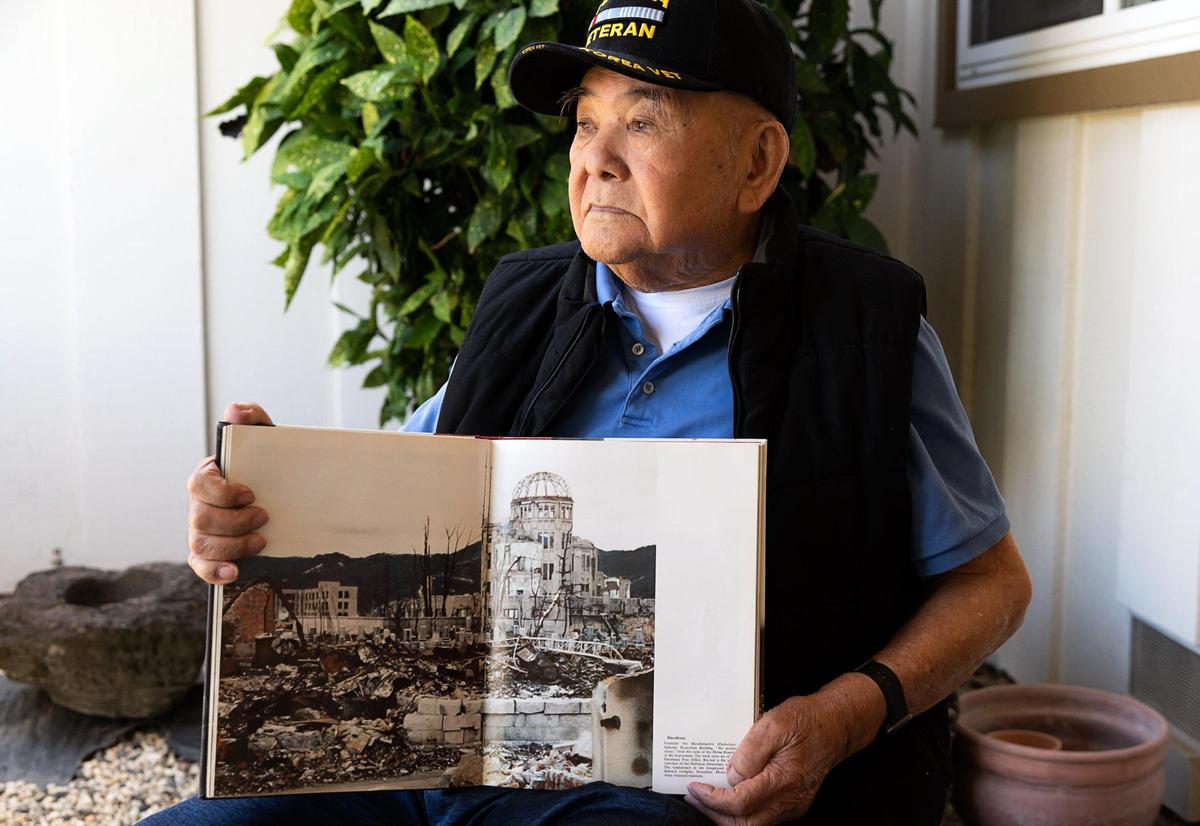 Hiroshima survivor Alfred Dote, 92, was a 17 year-old American citizen living in Japan when the atomic bomb was dropped during WWII. He came back to Sacramento in 1947 and was drafted in to the U.S. Army. He currently lives with his family in Sacramento’s Greenhaven area where he sits outdoors on Thursday, August 6, holding a book that shows the destruction.