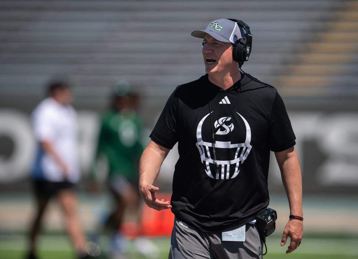 Sacramento State Hornets head coach Andy Thompson speaks to players before the annual Sacramento State Spring Football Game on April 20, 2024, at Sacramento State.