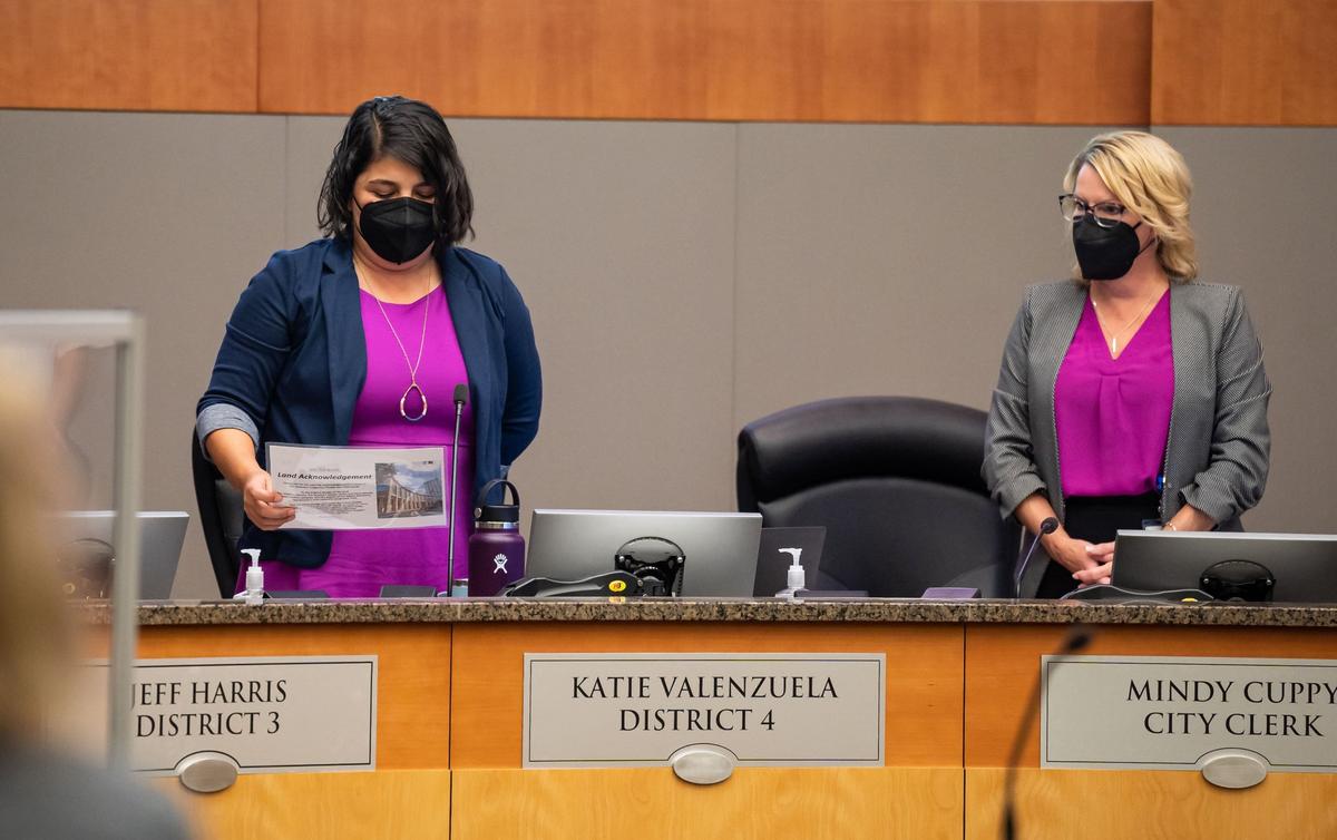 Sacramento City Councilwoman Katie Valenzuela, left, reads a land acknowledgment as Clerk Mindy Cuppy stands nearby Tuesday to start the first meeting open to public attendance at City Hall since the beginning of the COVID-19 pandemic.
