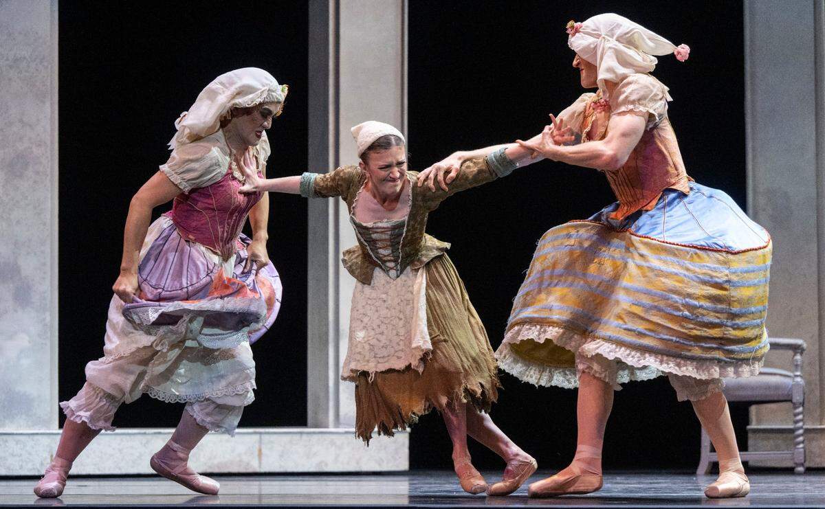 Cinderella (Michelle Katcher), center, pushes away her overbearing step sisters, danced by Eugene Obille, left, and Daniel Kubr, during Sacramento Ballet dress rehearsal at the SAFE Credit Union Performing Arts Center on Thursday. Choreographed by Paul Vasterling, the ballet is set to Sergei Prokofiev’s score with a live orchestra conducted by Ming Luke.