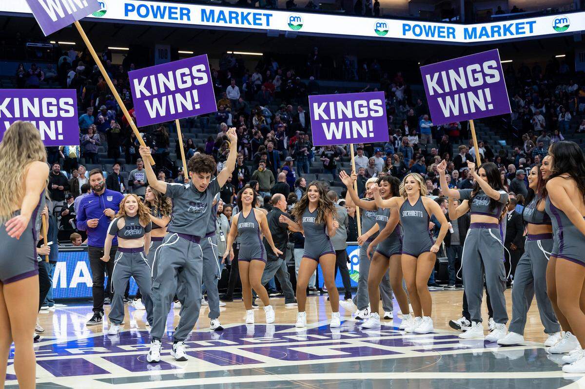 The 916 Crew celebrates at half court after the win against the Golden State Warriors on Nov. 13.