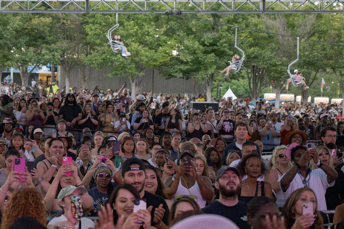 Fans of singer Ashanti watch her performance at the California State Fair on Wednesday night.