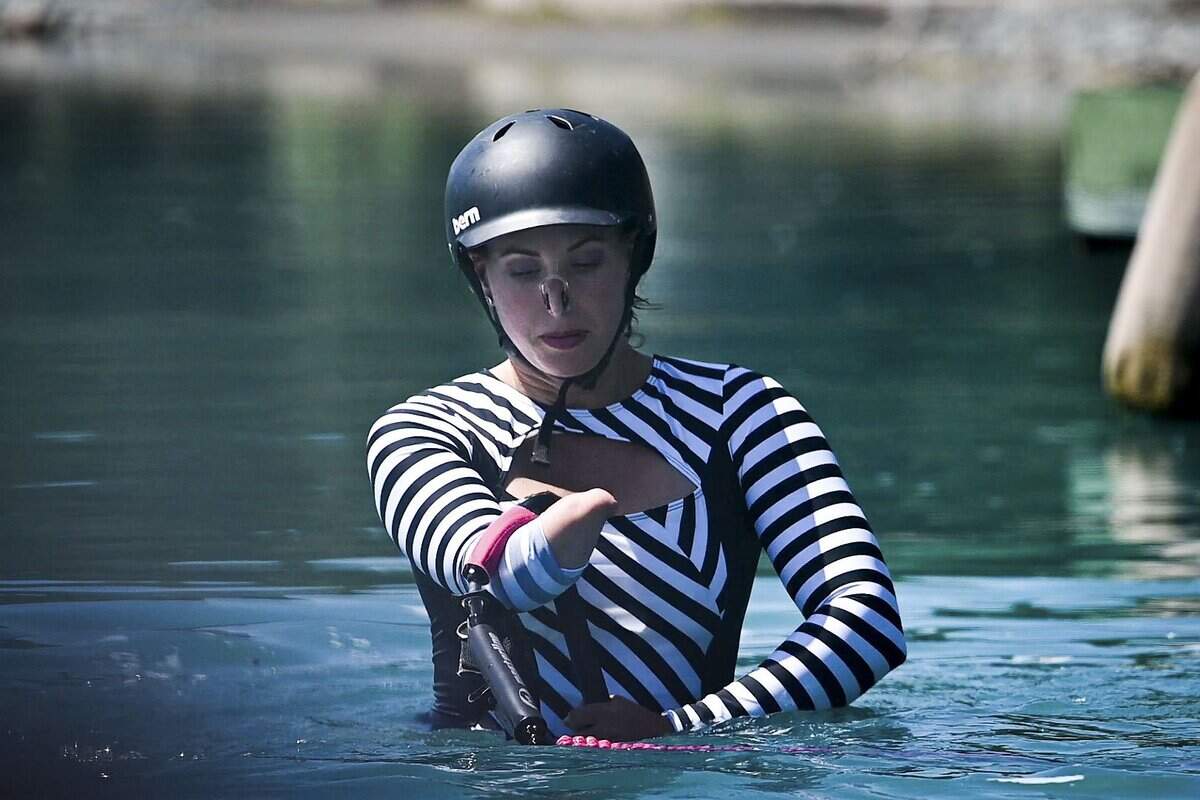 Elisha Nelson prepares to practice tricks at Bell Acqua Lake in Rio Linda in June. Nelson began water skiing at age 9.