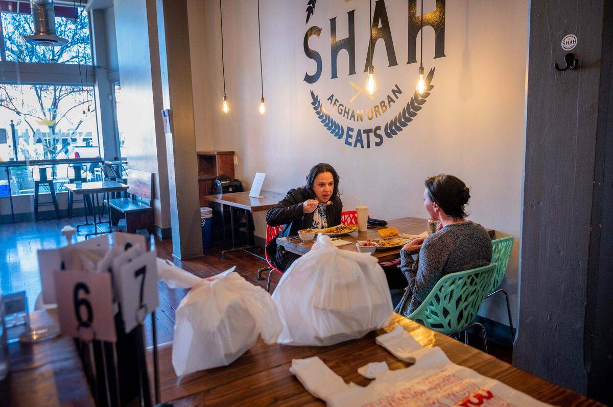Customers dine indoors for lunch at House of Shah Afgan Urban Eats in Woodland on Wednesday, Feb. 24, 2021. Yolo County moved into the State’s “red tier” of coronavirus risk, allowing indoor dining to reopen at 25% of capacity.