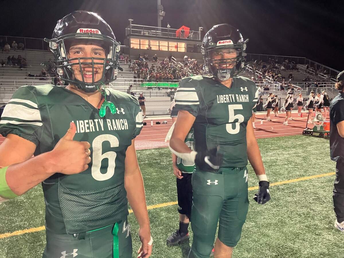 Liberty Ranch running back Arthur Draeger gives the thumbs-up sign while Armando Tapia looks on Thursday.