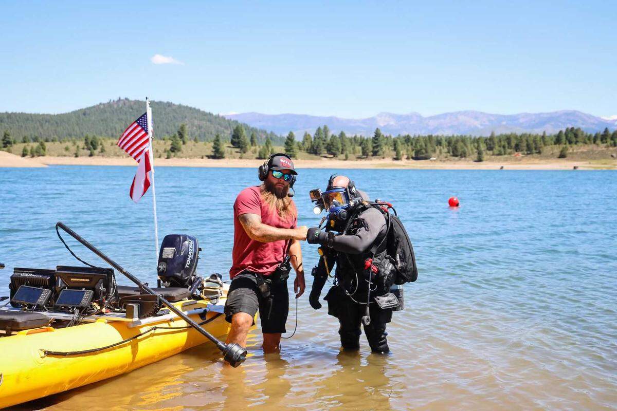 Doug Bishop, left, and Nick Rinn are photographed after Adventure with Purpose’s discovery of Kiely Rodni’s vehicle submerged in Prosser Creek Reservoir on Sunday, Aug. 21, 2022 near Truckee, Calif. The Oregon-based diving team located the SUV and a body believed to be that of missing teen Kiely Rodni.