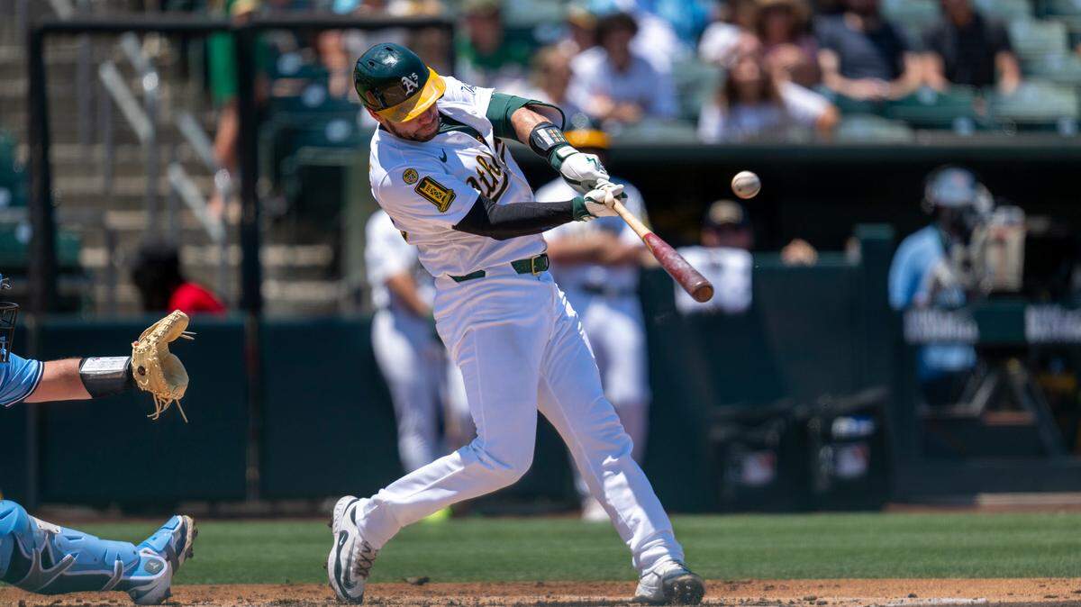 Athletics catcher Austin Wynns (29) hits a two-run home run in the second inning during a baseball game against the Toronto Blue Jays at Sutter Health Park in West Sacramento on Sunday.