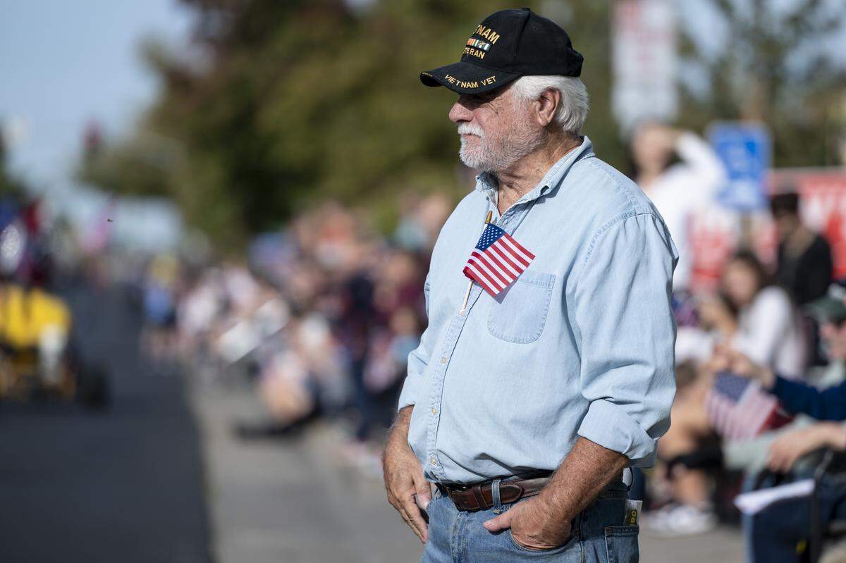 A Vietnam veteran watches a Veterans Day parade in Folsom on Tuesday, Nov. 11, 2025.