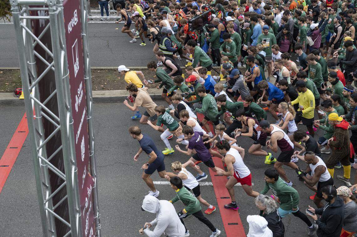 Runners push off at the start of the 5k race during the Run to Feed the Hungry in Sacramento on Thursday, Nov. 27, 2025.