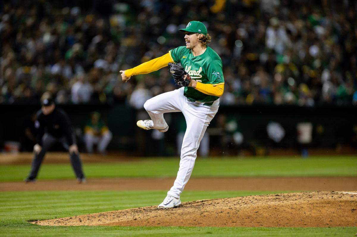 Sep 20, 2024; Oakland, California, USA; Oakland Athletics pitcher Tyler Ferguson (65) throws a pitch during the eighth inning against the New York Yankees at Oakland-Alameda County Coliseum. Mandatory Credit: Bob Kupbens-Imagn Images