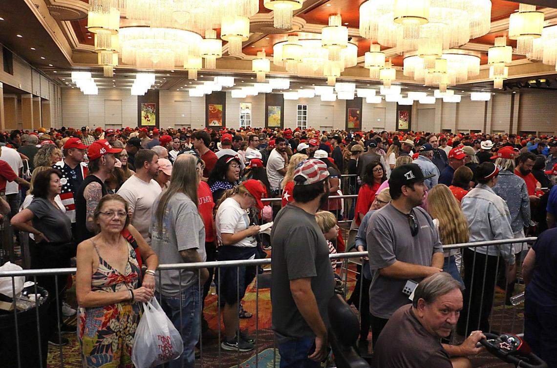 People line up to see Donald Trump during a rally at the Grand Sierra Resort in Reno on Oct. 11, 2024.