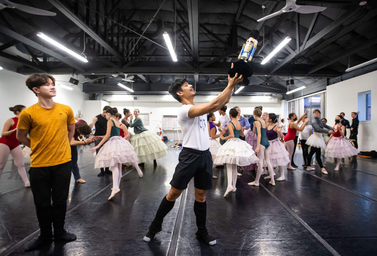 Sacramento Ballet dancer Victor Maguad, center, rehearses for the “Nutcracker” at their midtown Sacramento studios Tuesday, Nov. 29, 2022, in preparation for performances from Dec. 10 to 24. Second-company dancer Joseph Dang, left, prepares for his role as the “Nutcracker.”