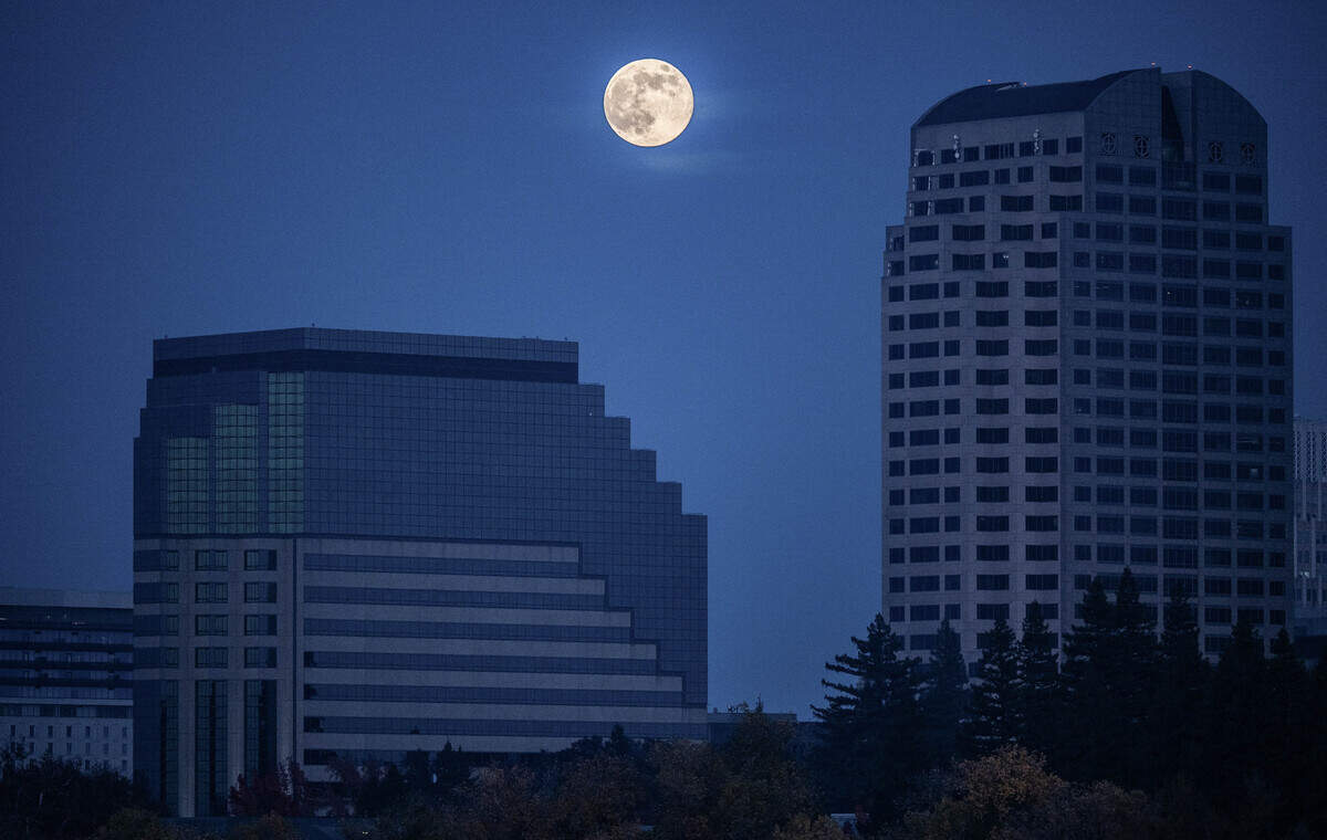 The supermoon rises over the Sacramento skyline on Thursday. The moon appears larger than usual because it’s at the closest point to the Earth in its elliptical orbit.