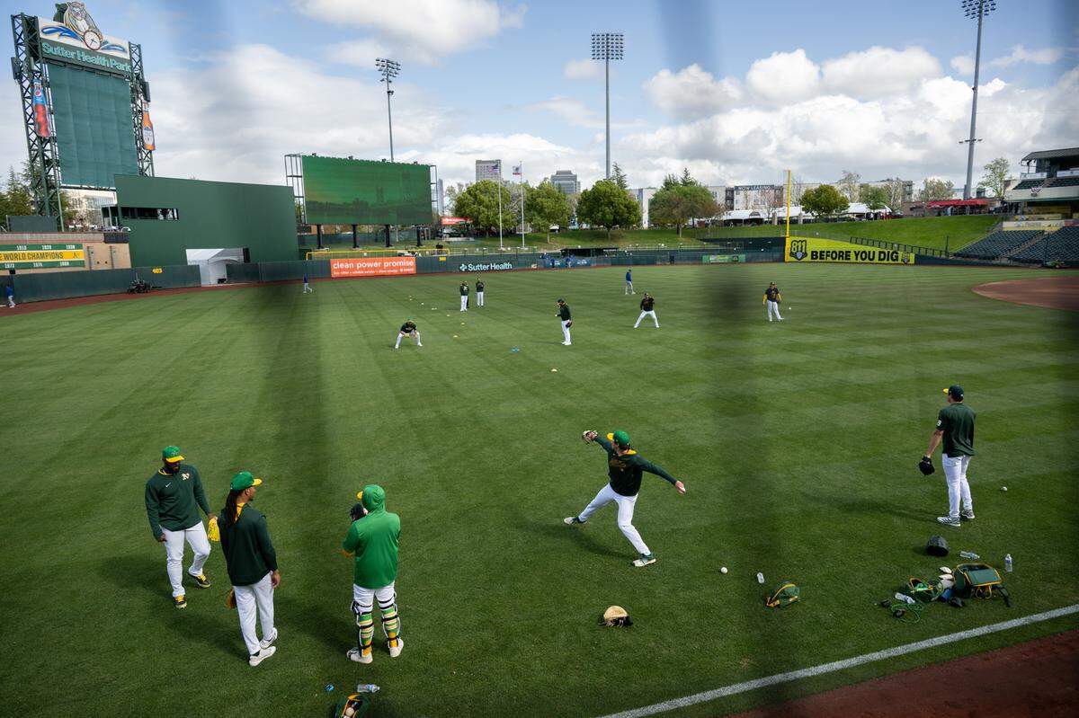 Athletics warm up before the first Major League Baseball game at Sutter Health Park on Monday, March 31, 2025, in West Sacramento.