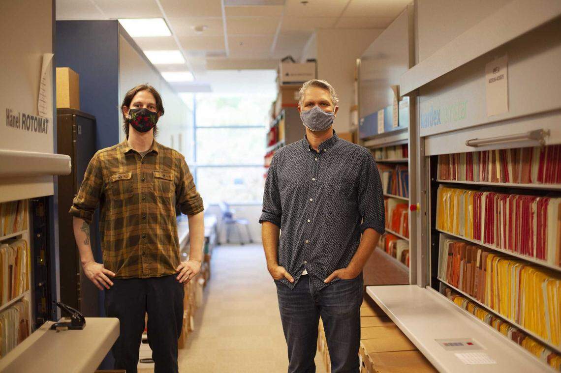 Analyst Matthew Jay, left, and Erik Ekdahl, deputy director of water rights in the State Water Resources Control Board records room. The room holds the history of California’s water rights, and is so heavy with paper that the floor needed to be reinforced.