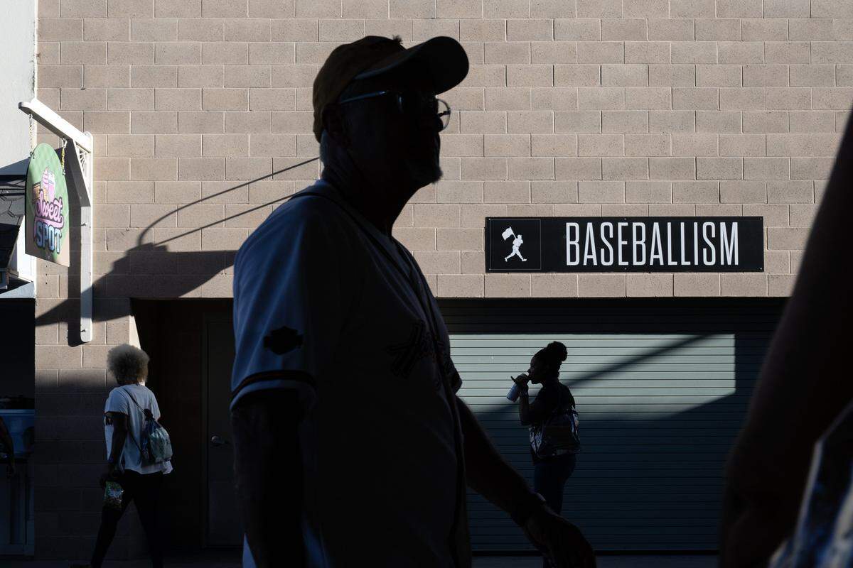 Baseball fans walk through the concourse during a Sacramento River Cats game earlier this month at Sutter Health Park in West Sacramento.