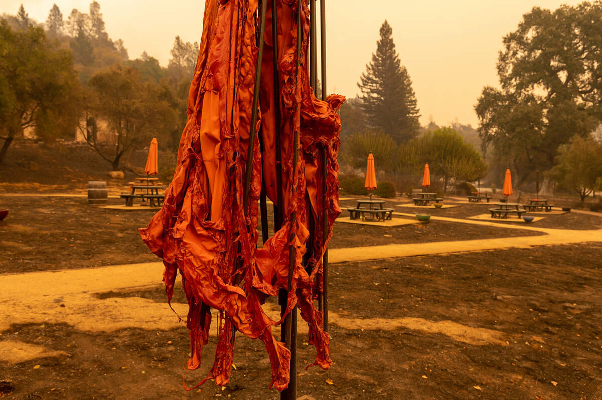 A melted umbrella remains in the picnic area of the Fairwinds Estate Winery near Calistoga after the Glass Fire burned through Napa County on Monday, Sept. 28, 2020.
