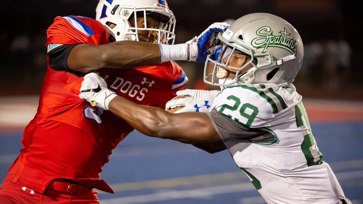 In their 2019 meeting, Folsom’s Elijhah Badger stiff-arms De La Salle’s Zeke Berry.