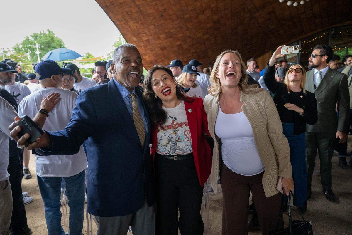 Sacramento City Council members Rick Jennings, Karina Talamantes and Caity Maple sing “Take Me Out to the Ball Game” after Sacramento regional leaders announce the region’s bid for a Major League Baseball expansion team during a press conference at The Barn in West Sacramento on Thursday.