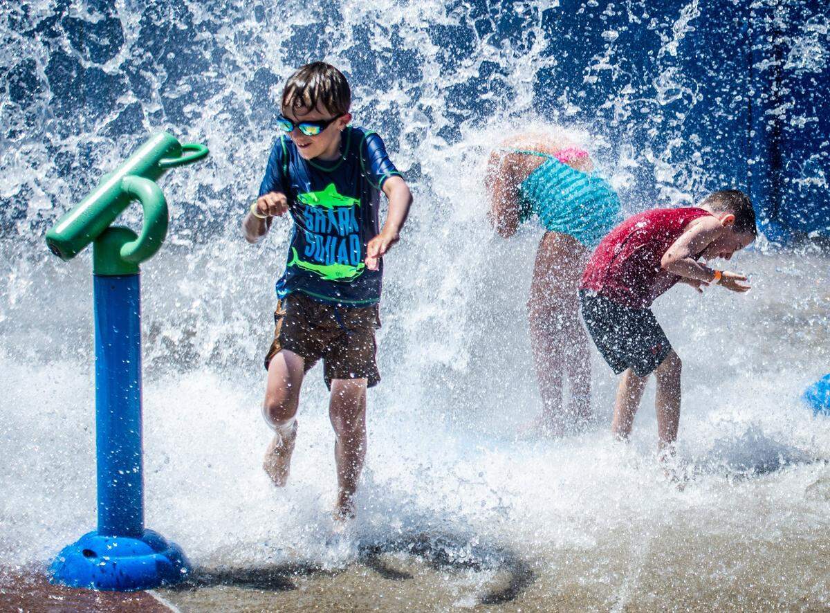 Children play at White Rock Splash Park in Rancho Cordova’s White Rock Community Park in this 2021 file photo.