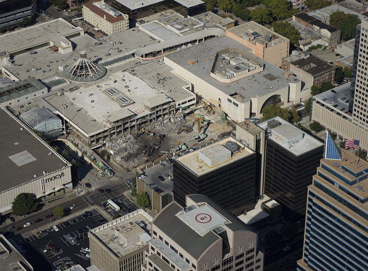 Workers demolish Downtown Plaza at Fifth and L streets in Sacramento in August 2014. Golden 1 Center now stands on the site.