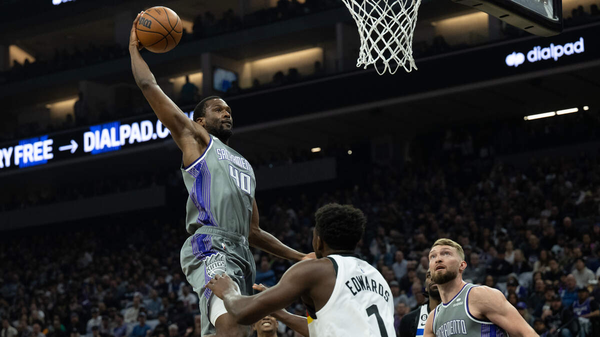 Sacramento Kings forward Harrison Barnes (40) dunks over Minnesota Timberwolves guard Anthony Edwards (1) in the first quarter during a game at Golden 1 Center in Sacramento, Monday, March 27, 2023.