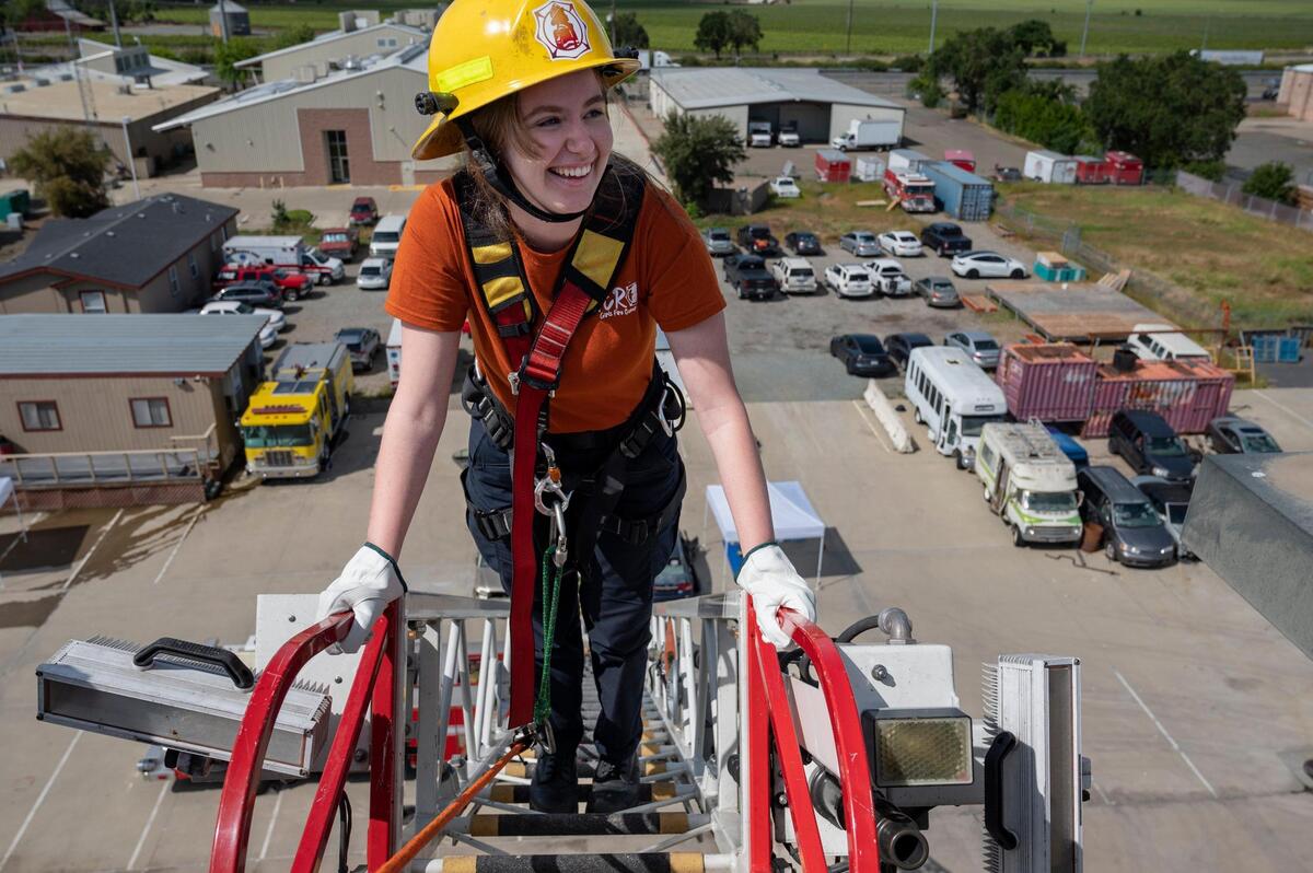 Stephanie Forbes smiles as she takes in the view after climbing up about 100 feet on the aerial ladder during the camp. “This is so cool” Forbes exclaimed as she reached the top of the ladder. “This is the craziest thing I’ver ever done.”