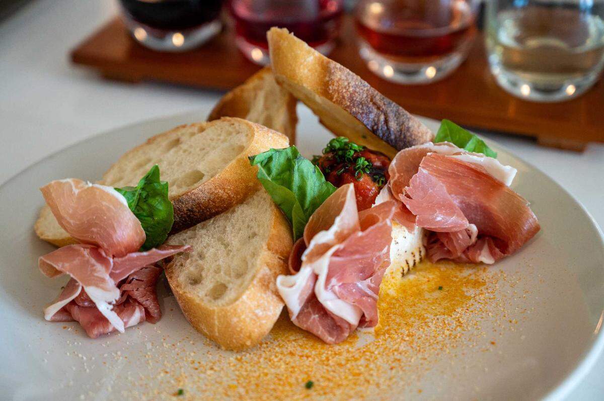 Torched burrata with prosciutto, jelly tomatoes, basil and toast is available at Ever After Wine in Elk Grove on Wednesday.