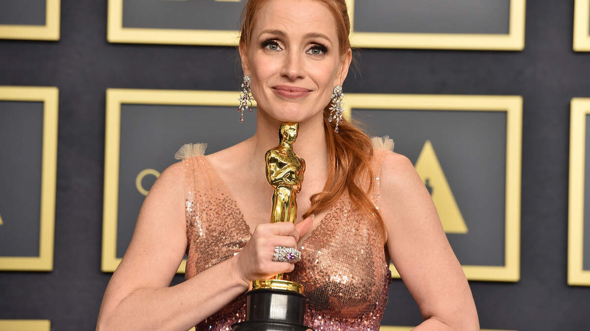Jessica Chastain, winner of the award for best performance by an actress in a leading role for “The Eyes of Tammy Faye”, poses in the press room at the Oscars on Sunday, March 27, 2022, at the Dolby Theatre in Los Angeles. (Photo by Jordan Strauss/Invision/AP)
