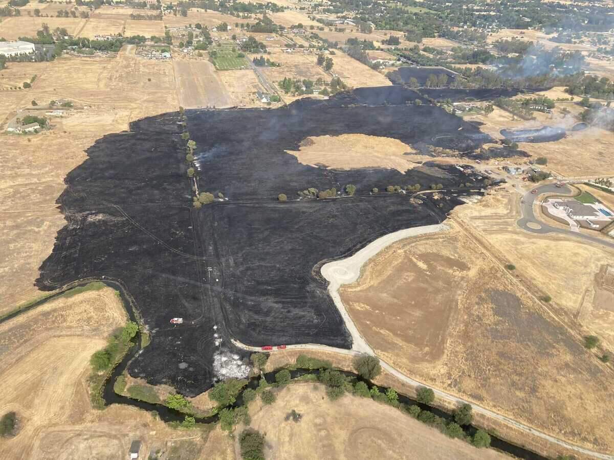 Cosumnes fire officials said the view from a Sacramento Metro Fire helicopter overhead indicated a two-alarm grass fire had burned 73 acres along Sheldon Road in Elk Grove, California on Wednesday June 16, 2021.