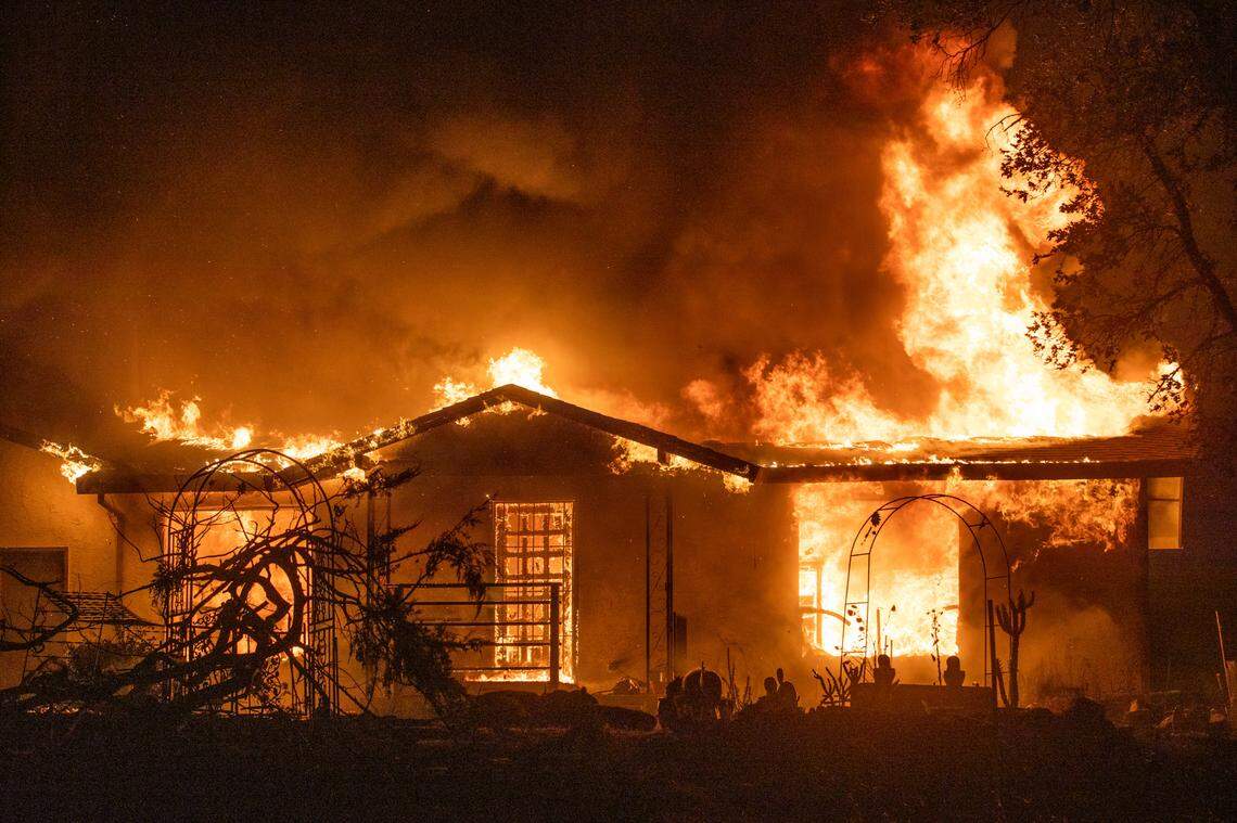 A house burns on Platina Road at the Zogg Fire near Ono on Sunday, Sep. 27, 2020.