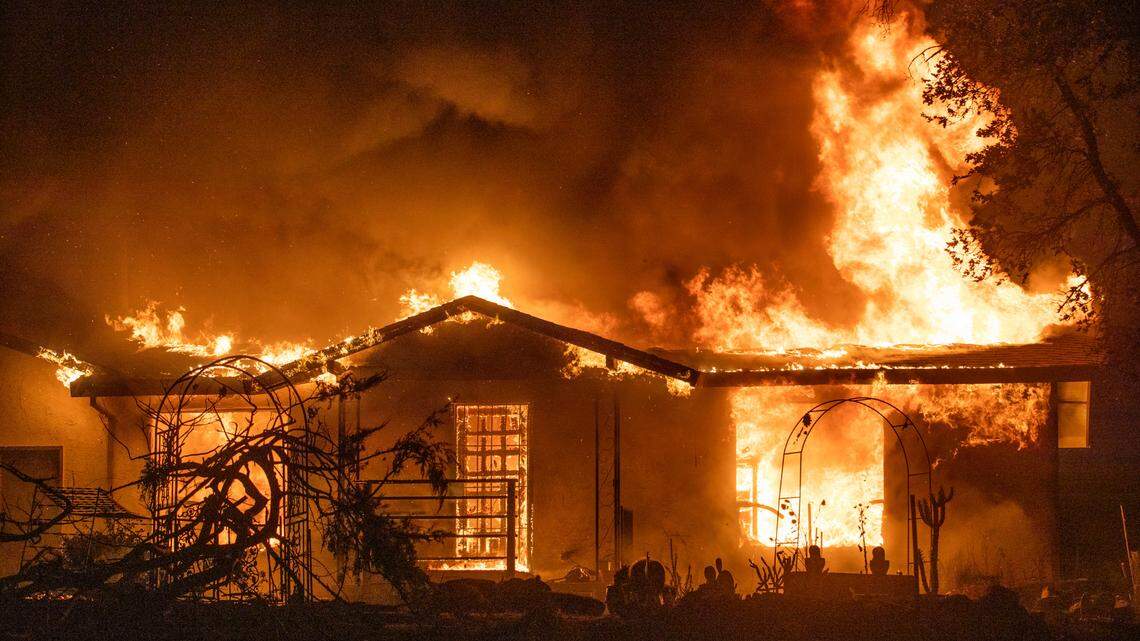 A house burns on Platina Road at the Zogg Fire near Ono, Calif., on Sunday, Sep. 27, 2020. (AP Photo/Ethan Swope)
