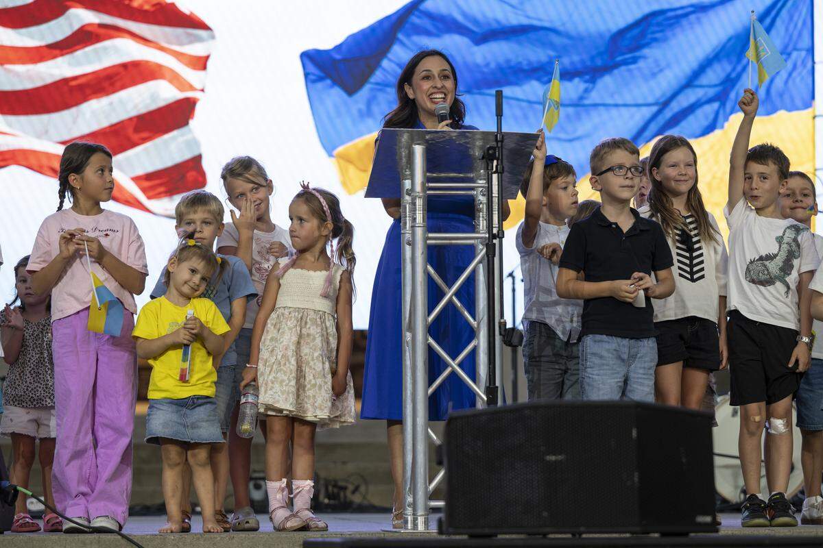 Sacramento City Councilmember Karina Talamantes invites children onstage for her speech during a Ukrainian Independence Day celebration at the California Capitol in Sacramento on Sunday.