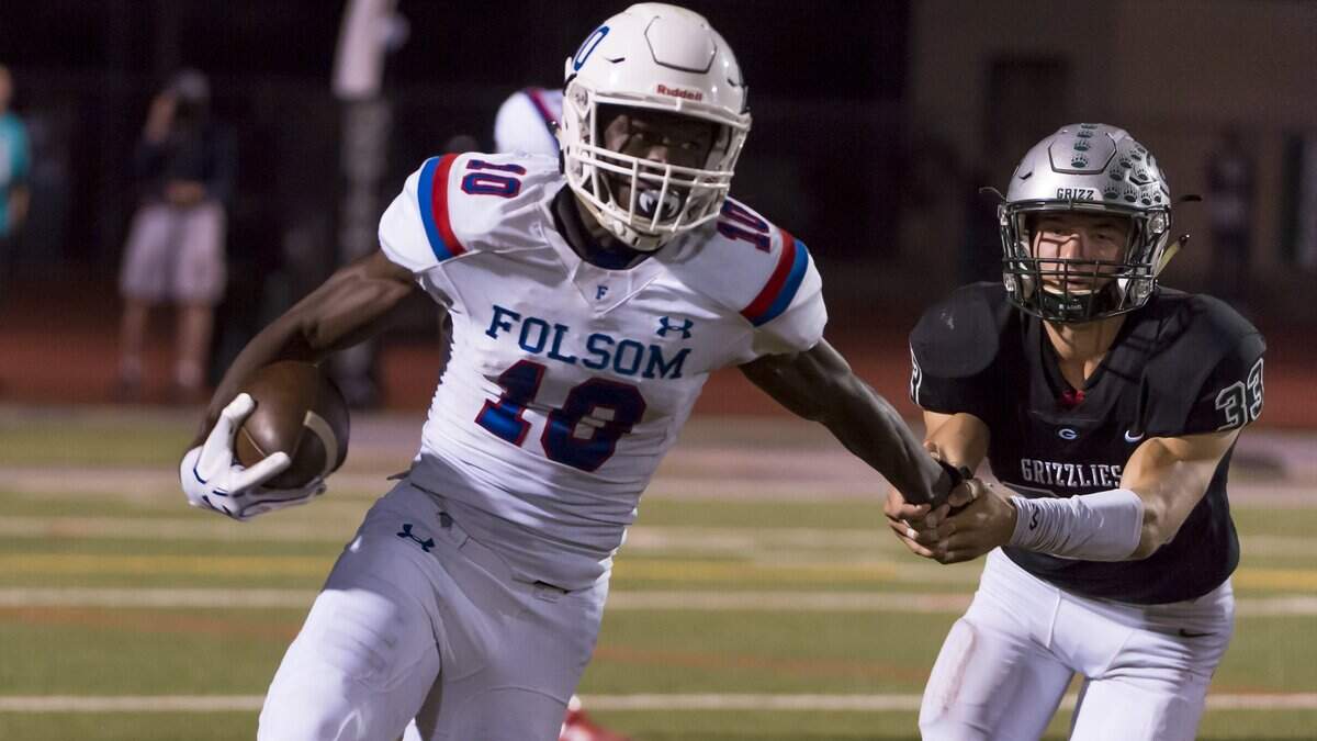 Granite Bay’s Nolan Stabbert attempts to tackle Folsom’s Joe Ngata, who broke free and ran for a touchdown on Sept. 29, 2017 in Folsom.