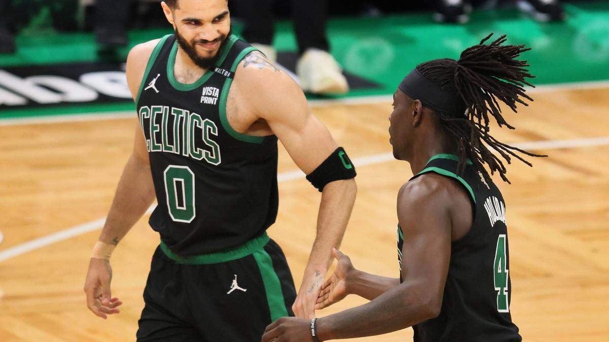 Boston Celtics’ Jayson Tatum and Jrue Holiday exchange high fives during Game 2 of the NBA Finals at the TD Garden . (Nancy Lane/Boston Herald/TNS)