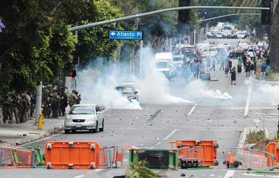 People block off the street and set a fire during protests against ICE and immigration raids on Saturday, June 7, 2025, in Paramount. Gov. Gavin Newsom condemned the announced federal deployment of National Guard troops to the area Saturday, calling it “purposefully inflammatory” and warning it would “erode public trust.”