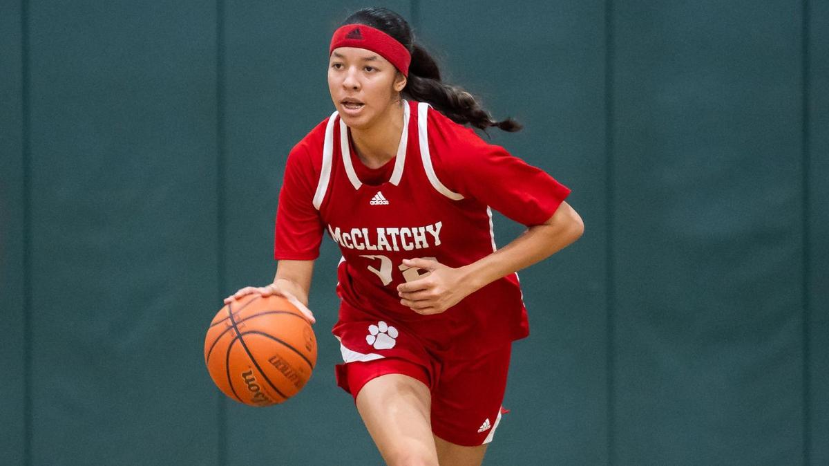 The McClatchy Lions’ Nina Cain (22) dribbles downcourt during the second quarter at the high school girls basketball game Friday at Monterey Trail High School in Elk Grove.