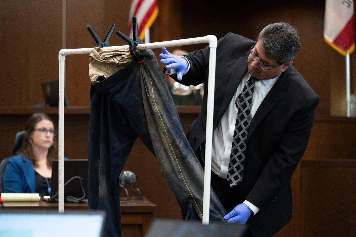 Davis Police Department detective Alex Torres describes the dirt on a pair of sweat pants that was worn by David Breaux, who was allegedly stabbed to death by former UC Davis student Carlos Reales Dominguez, during the first day of trial at Yolo Superior Court in Woodland on Monday.