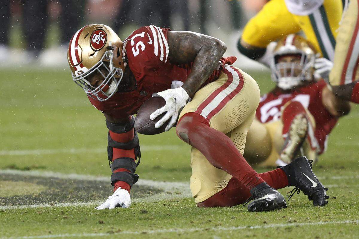 SANTA CLARA, CALIFORNIA - JANUARY 20: Dre Greenlaw #57 of the San Francisco 49ers intercepts a pass during the fourth quarter against the Green Bay Packers in the NFC Divisional Playoffs at Levi's Stadium on January 20, 2024 in Santa Clara, California. (Photo by Lachlan Cunningham/Getty Images)