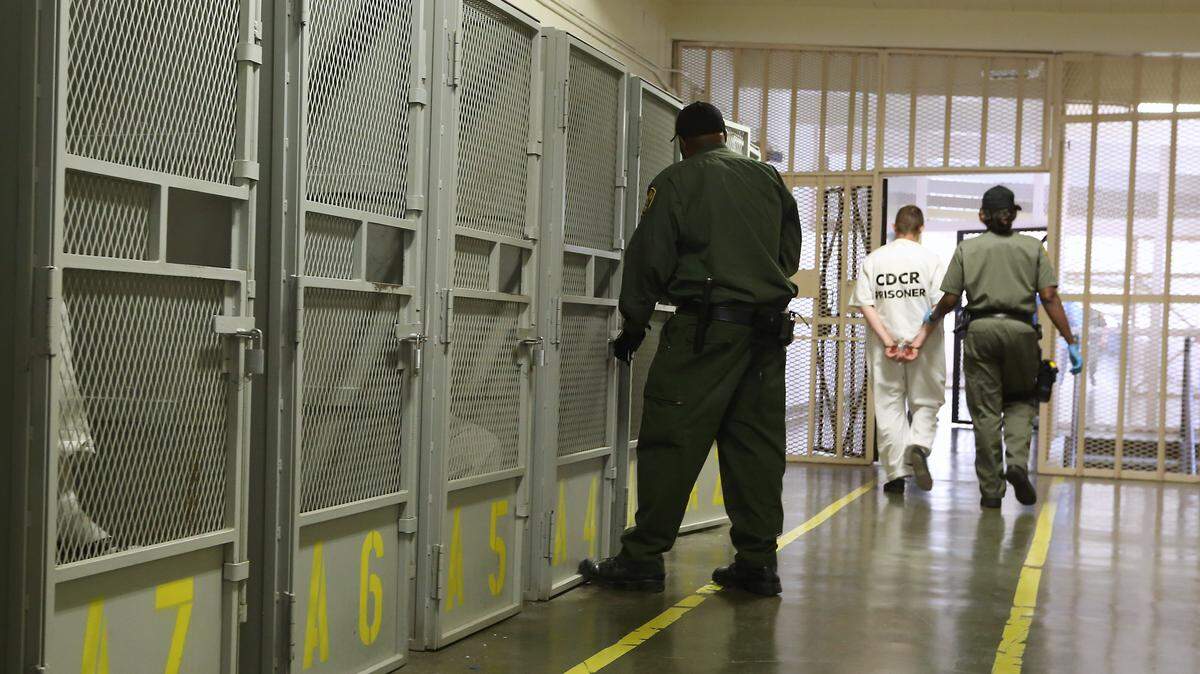 An inmate is moved to a housing unit after a session with a psychologist at the prison medical facility in Vacaville in 2014. The California prison system’s chief psychiatrist is alleging substandard care.