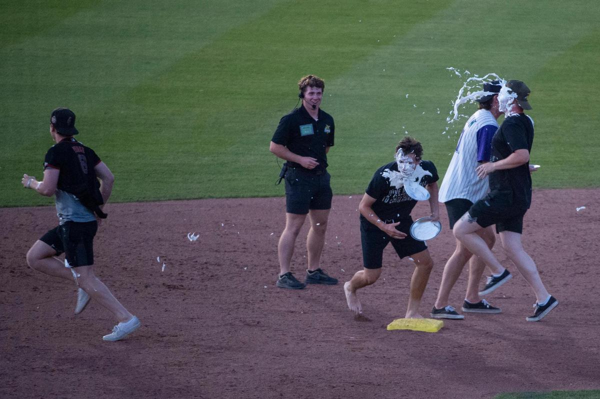 Fans play “pie-to-the-face” relay race during the Savannah Bananas World Tour on Saturday, July 29, 2023, at Sutter Health Park in West Sacramento.