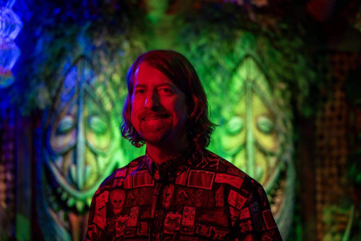 Troy Carlson, the creator and owner of Hawthorne’s Hideout, stands in his Tiki-inspired immersive underground Old Sacramento speakeasy on Thursday. The bar is in the basement of his Stage Nine Entertainment store. 