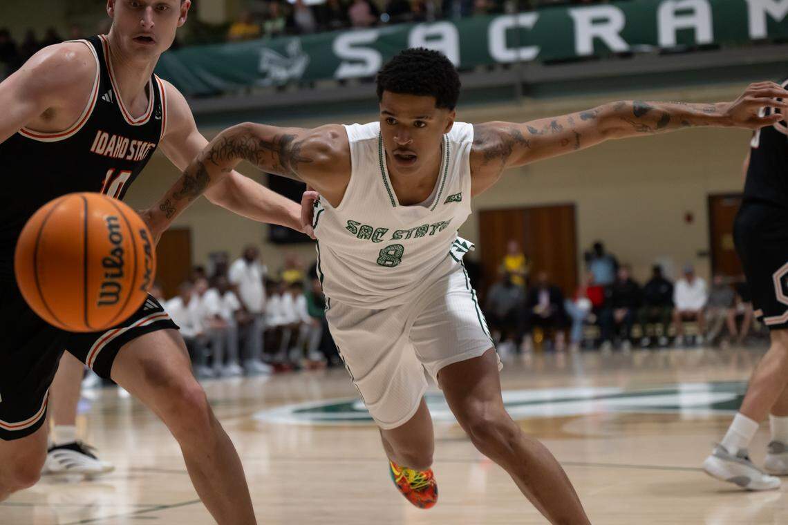 Sacramento State Hornets forward Shaqir O'Neal (8) and Idaho State Bengals forward Connor Hollenbeck (10) battle for the ball during a game at Sacramento State on Monday.
