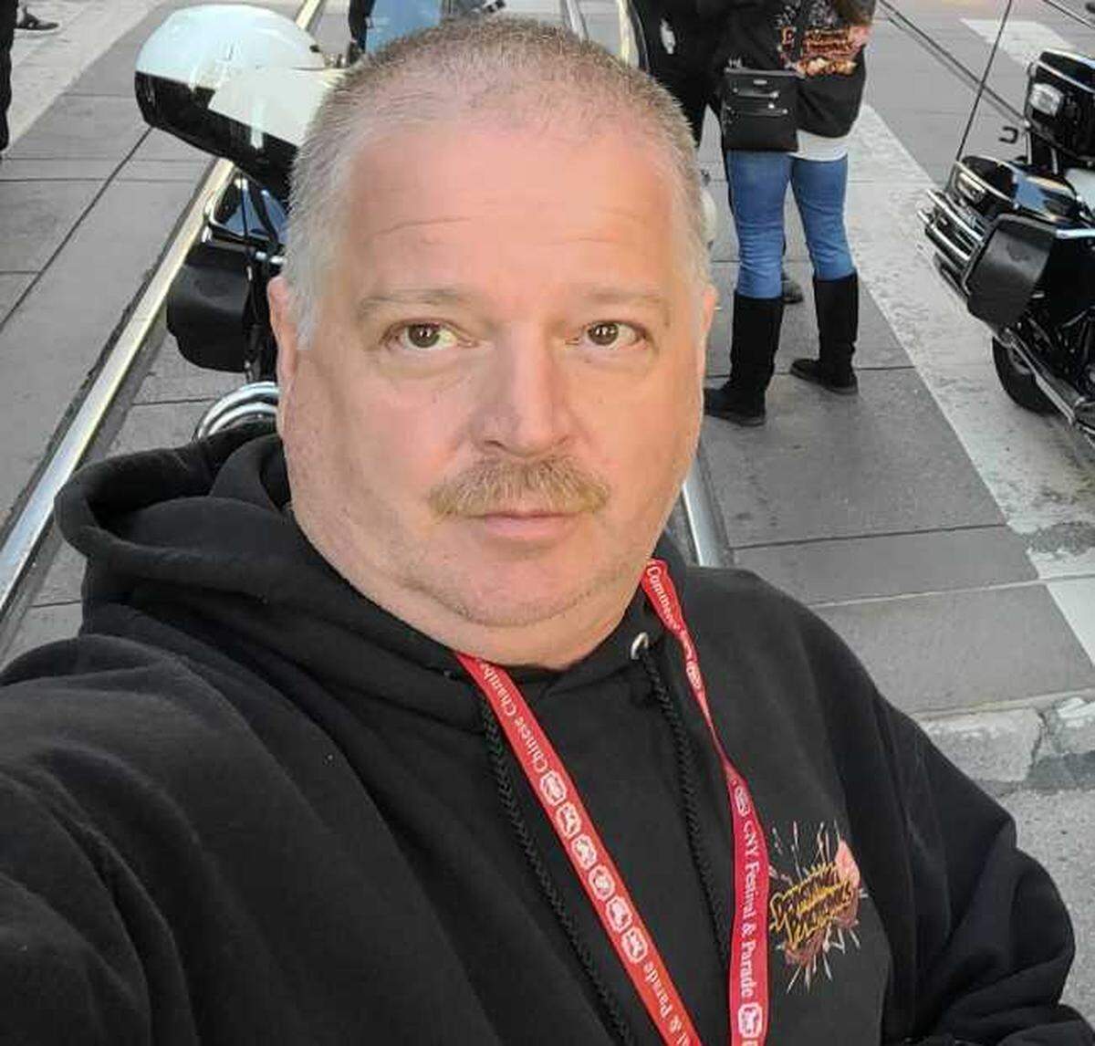 Doug Tollefsen, seen in Devastating Pyrotechnic sweatshirt at an event in San Francisco in March 2025, is one of eight people indicted by a Yolo County criminal grand jury in connection with the July 1, 2025, explosion at an Esparto warehouse that killed seven.