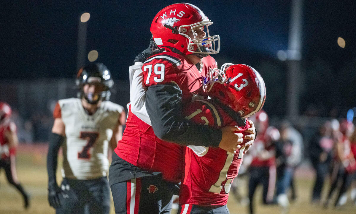 Winters Warriors offensive lineman Dylan Neal (79) celebrates the touchdown run of Jesse Madsen (13) against the Arcata Tigers in the second quarter of the CIF Northern California Division 6-AA regional football championship game on Friday.
